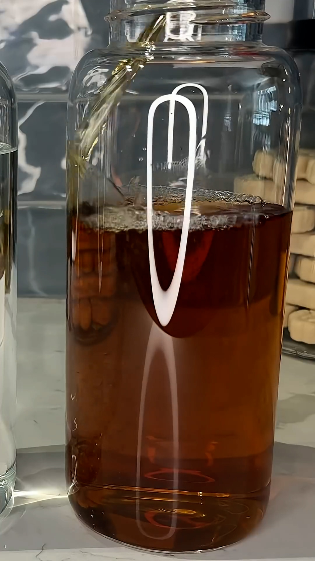 A capsule machine pours a matching pair of cocktails for two