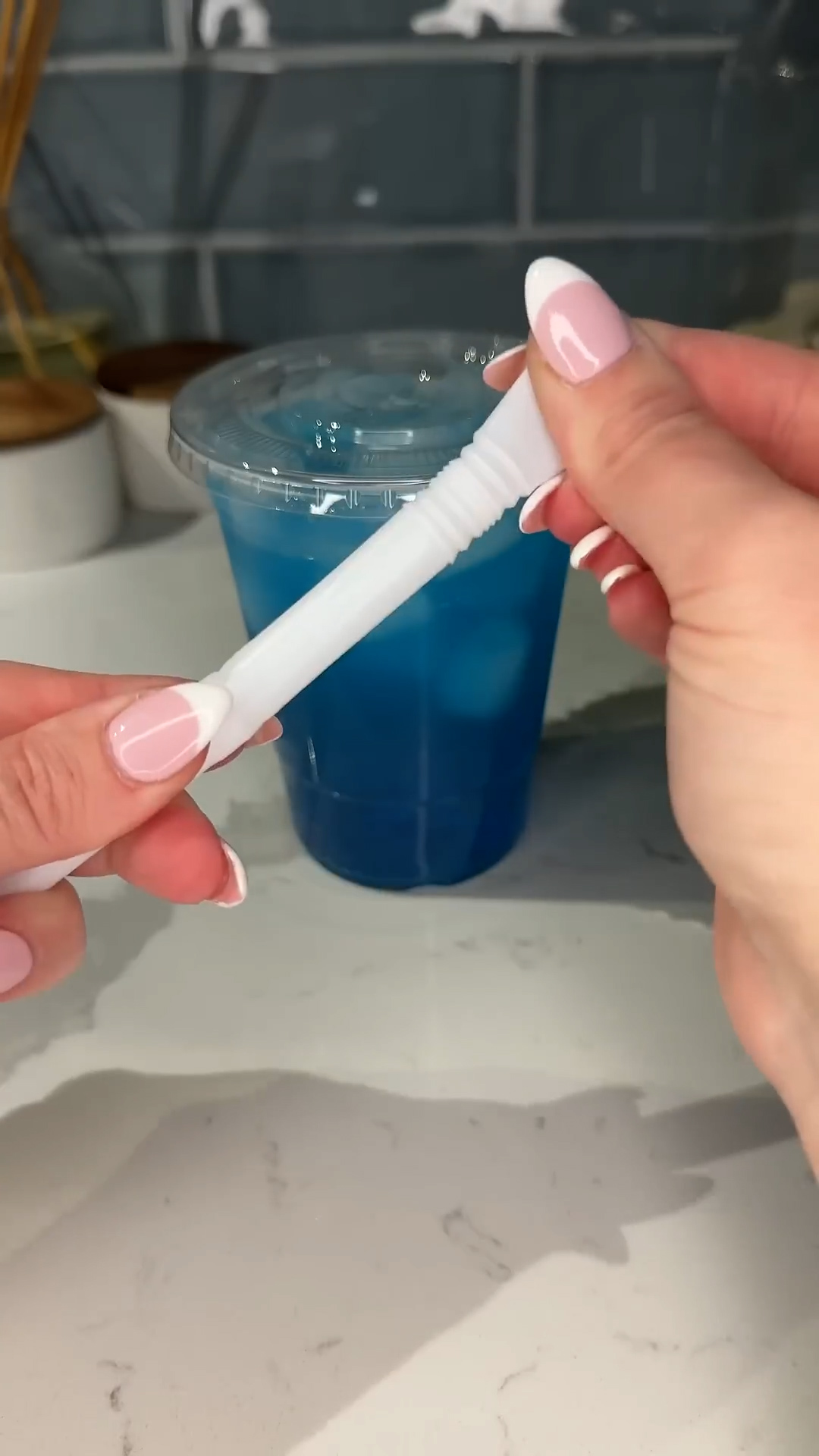 Chewy boba pearls drop into a creamy blue coconut nighttime sip